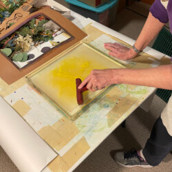 Rolling out the first layer of acrylic paint.